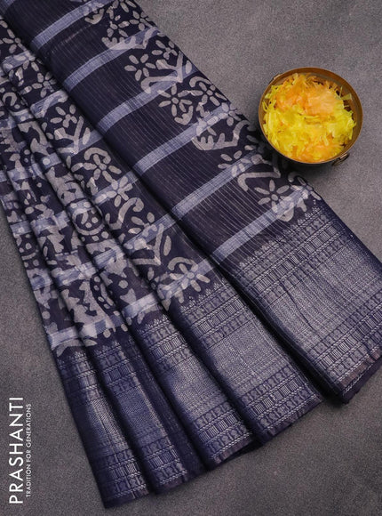 Semi tussar saree navy blue and off white with allover batik prints and long silver zari woven border