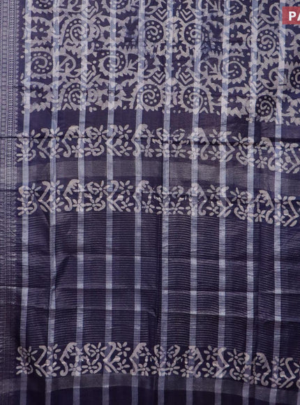 Semi tussar saree navy blue and off white with allover batik prints and long silver zari woven border