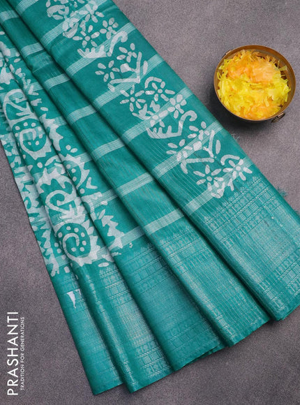 Semi tussar saree teal green and off white with allover batik prints and long silver zari woven border