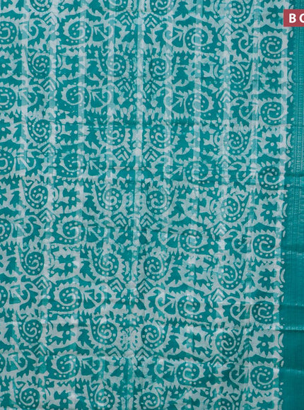 Semi tussar saree teal green and off white with allover batik prints and long silver zari woven border