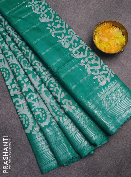 Semi tussar saree teal green and off white with allover batik prints and temple design silver zari woven border