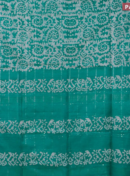 Semi tussar saree teal green and off white with allover batik prints and temple design silver zari woven border