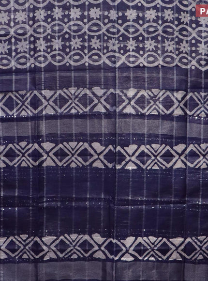 Semi tussar saree navy blue and off white with allover batik prints and long temple design silver zari woven border