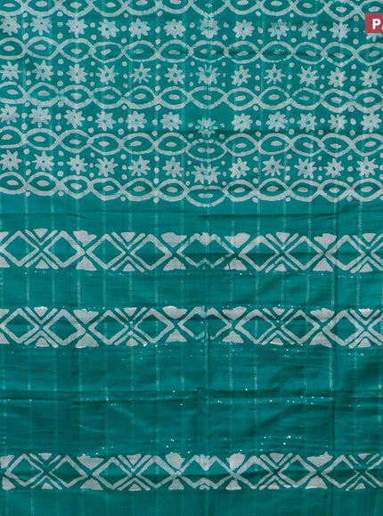 Semi tussar saree teal green with allover batik prints and long temple design silver zari woven border