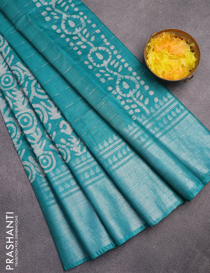 Semi tussar saree teal green and beige with allover batik prints and long silver zari woven border