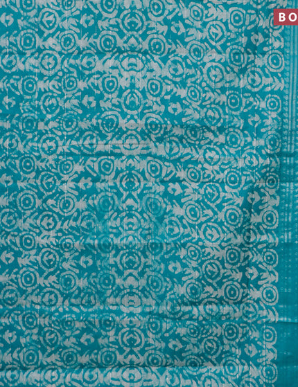 Semi tussar saree teal green and beige with allover batik prints and long silver zari woven border