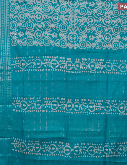 Semi tussar saree teal green and beige with allover batik prints and long silver zari woven border