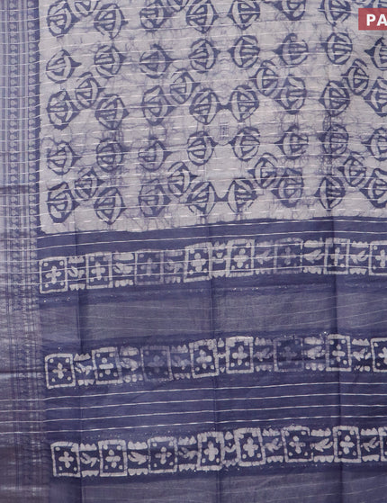 Semi tussar saree off white and dark grey with allover batik prints and long zari woven border