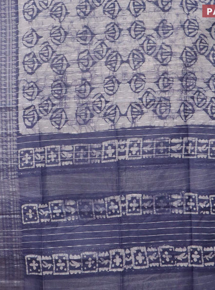 Semi tussar saree off white and dark grey with allover batik prints and long zari woven border