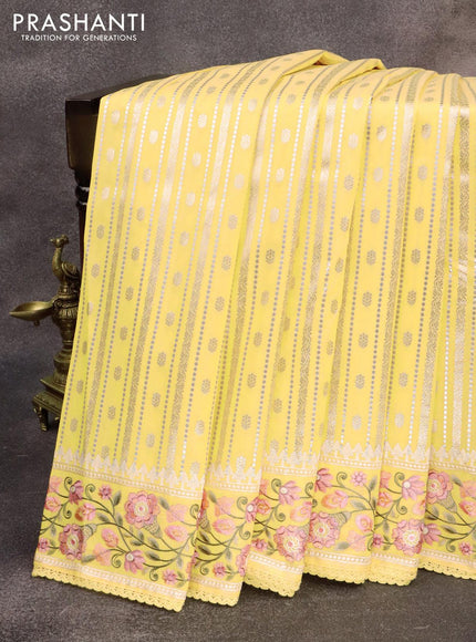 Banarasi cotton saree pale yelloew with allover silver & gold zari weaves and floral embroidery border