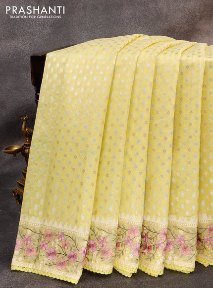 Banarasi cotton saree pale yellow with allover silver & gold zari woven butta weaves and floral embroidery border