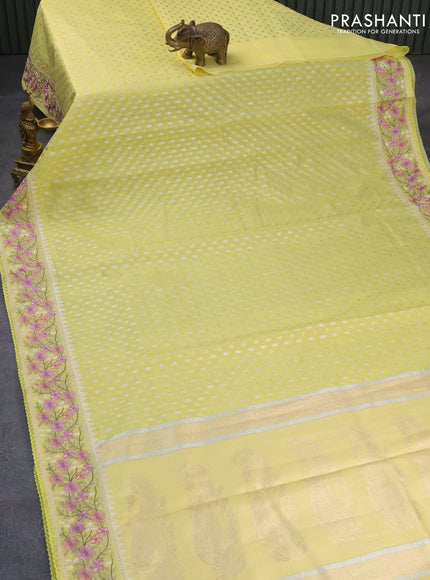 Banarasi cotton saree pale yellow with allover silver & gold zari woven butta weaves and floral embroidery border