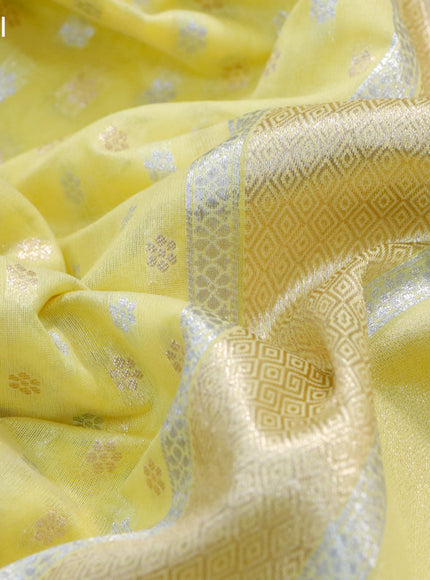 Banarasi cotton saree pale yellow with allover silver & gold zari woven butta weaves and floral embroidery border