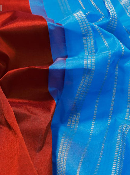 Silk cotton saree rustic brown and cs blue with plain body and rettapet zari woven korvai border