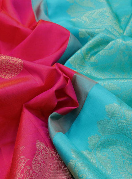 Pure kanjivaram silk saree dual shade of pinkish orange and teal blue with paisley zari woven buttas and long zari woven border & butta style