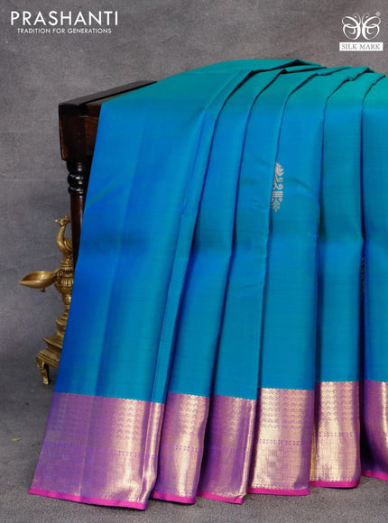 Pure kanjivaram silk saree dual shade of bluish green and purple with zari woven buttas and zari woven border & butta style