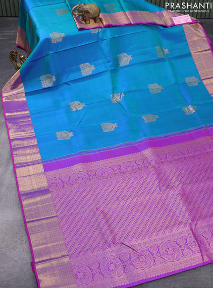 Pure kanjivaram silk saree dual shade of bluish green and purple with zari woven buttas and zari woven border & butta style