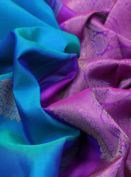 Pure kanjivaram silk saree dual shade of bluish green and purple with zari woven buttas and zari woven border & butta style