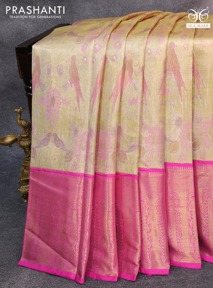 Pure kanjivaram tissue silk saree elaichi green and pink with allover zari woven parrot designbrocade weaves and long zari woven korvai border