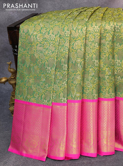 Pure kanjivaram silk saree green and pink with allover zari woven brocade weaves and long zari woven annam border