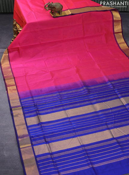 Silk cotton saree dual shade of pinkish orange and blue with plain body and zari woven border