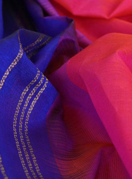 Silk cotton saree dual shade of pinkish orange and blue with plain body and zari woven border