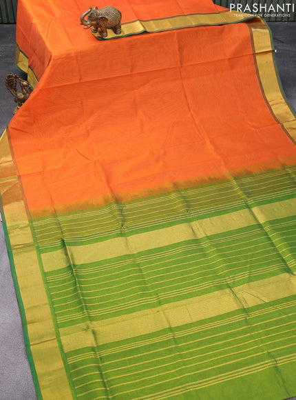 Silk cotton saree orange and green with plain body and zari woven border