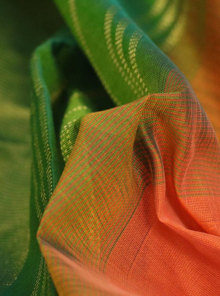 Silk cotton saree orange and green with plain body and zari woven border