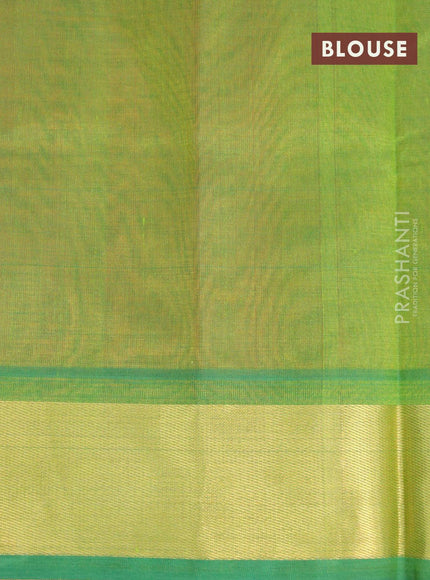 Silk cotton saree orange and green with plain body and zari woven border