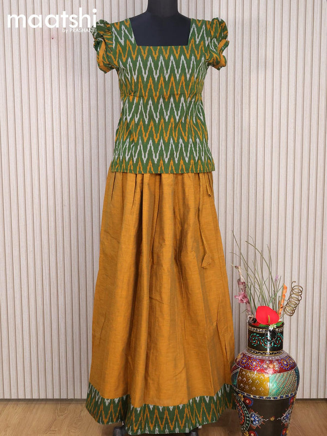 Cotton kids lehanga green and dark mustard with allover ikat weaves and back knot for 15 years - {{ collection.title }} by Prashanti Sarees