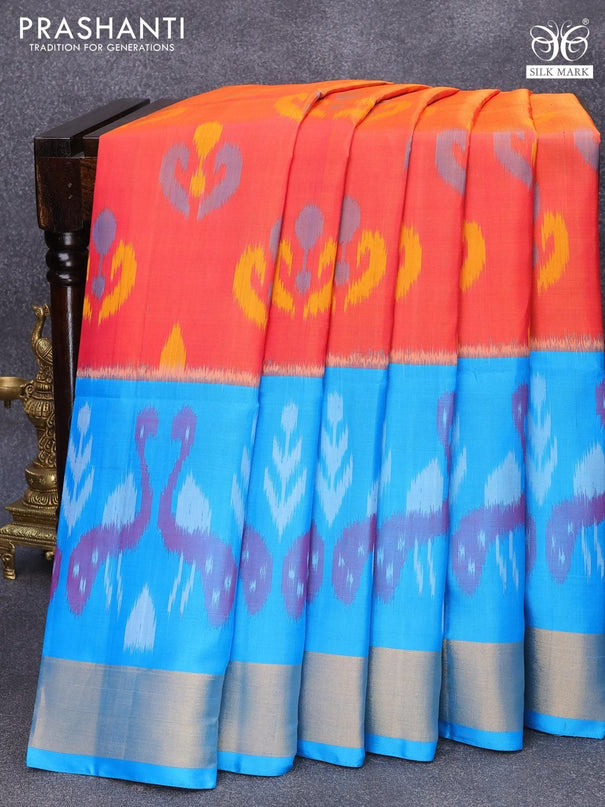 Ikat soft silk saree dual shade of pinkish orange and blue with allover ikat butta weaves and zari woven border - {{ collection.title }} by Prashanti Sarees