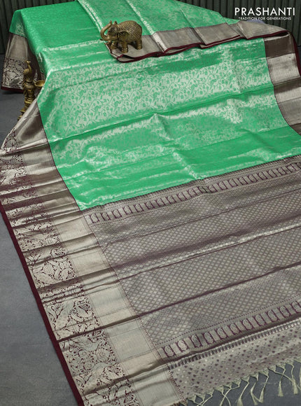 Pure kanjivaram tissue silk saree teal green and deep maroon with allover silver zari woven brocade weaves and long rich silver zari woven peacock design border & embroidery work blouse - {{ collection.title }} by Prashanti Sarees