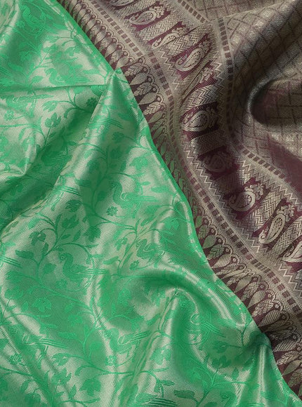 Pure kanjivaram tissue silk saree teal green and deep maroon with allover silver zari woven brocade weaves and long rich silver zari woven peacock design border & embroidery work blouse - {{ collection.title }} by Prashanti Sarees