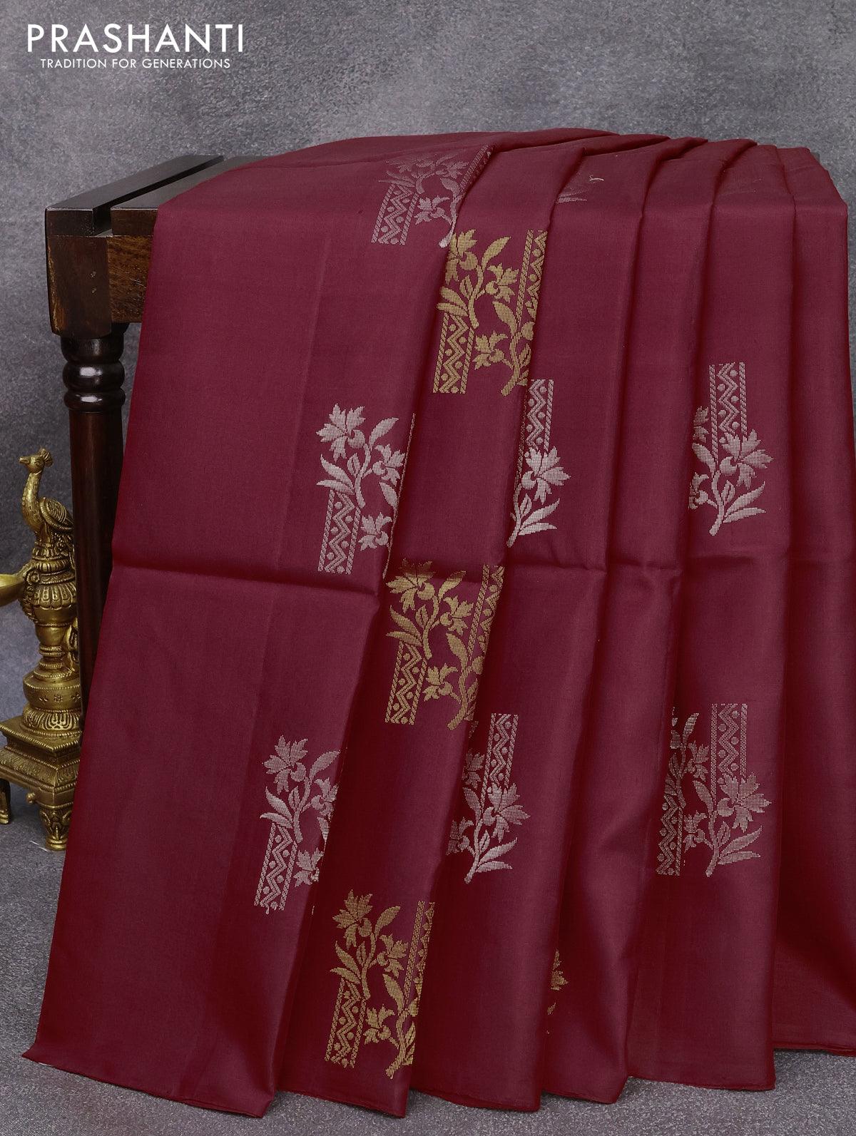 Borderless red soft silk saree with all-over geometrical zari buttas,  self-pallu woven in floral jaal pattern