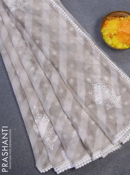 Semi orangza saree off white and grey with allover ikat prints & embroidery buttas and crocia lace border - {{ collection.title }} by Prashanti Sarees