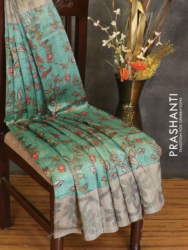 Semi jute silk saree teal green and grey shade with digital prints woven buttas and floral woven border