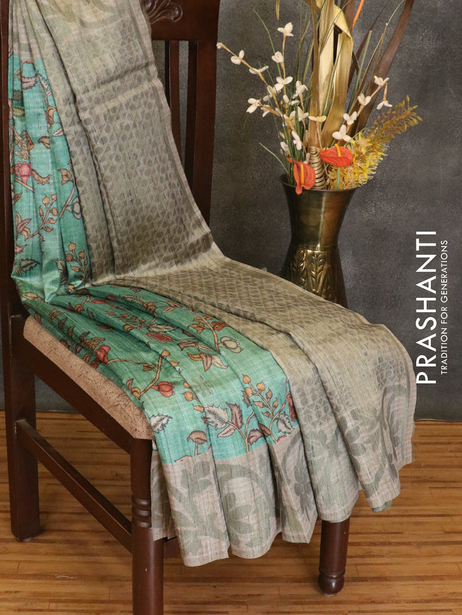 Semi jute silk saree teal green and grey shade with digital prints woven buttas and floral woven border